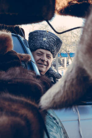 ZABOLOTTIA, UKRAINE - 20 January 2009: Man in papakha at local market in winterのeditorial素材