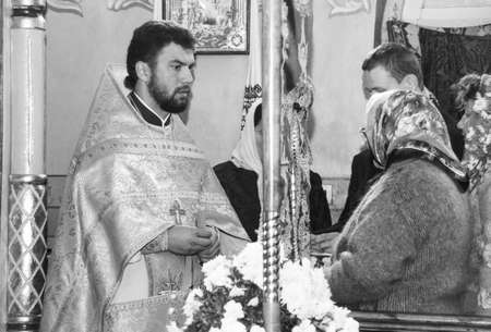 VOYUTYN, UKRAINE - 14 October 2008:  Priests and parishioners of the Orthodox Church during the...