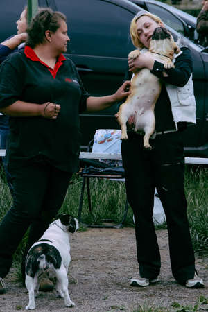 LUTSK, UKRAINE - 20 September 2009: Two women with dog at parkのeditorial素材