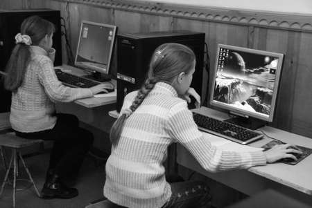 STARA, UKRAINE - 23 December 2008: Female elementary school children in computer classのeditorial素材