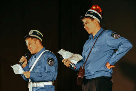 LUTSK, UKRAINE - 24 November 2009:Two actors in the uniform of the officers of the car inspection on the stage during a humorous showのeditorial素材