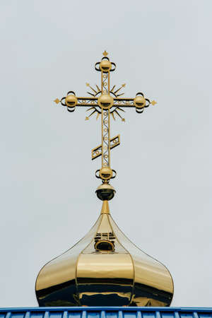 Orthodox church dome with cross on the sky backgroundの写真素材