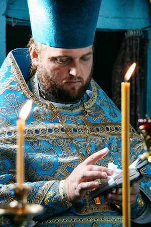 VOYUTYN, UKRAINE - 14 OCTOBER 2008: Orthodox priest during celebration Pokrov