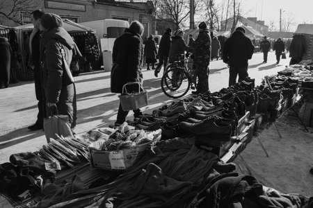 ZABOLOTTIA, UKRAINE - 20 January 2009: Shopping tents and people on the local market in winterのeditorial素材