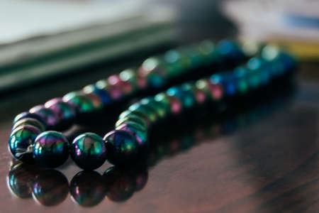 Rosary beads on table. Shallow depth of field.の写真素材