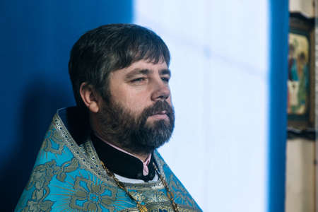 VOYUTYN, UKRAINE - 14 OCTOBER 2017: Orthodox priest during celebration Pokrov