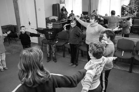 Zabolottia, Volyn / Ukraine - February 11 2009: Teacher taking exercise class at boarding school for children with intellectual disabilitiesのeditorial素材