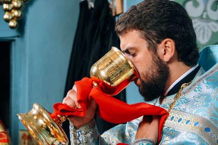 Voyutyn, Volyn / UKRAINE - October 14 2009: Priest during orthodox liturgy ceremonyのeditorial素材