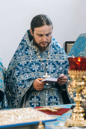 VOYUTYN, Volyn / UKRAINE - 14 OCTOBER 2017: Orthodox priest during celebration Pokrovのeditorial素材