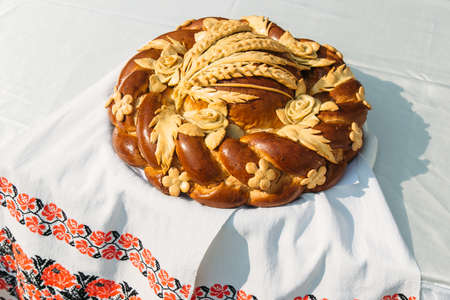 Traditional ukrainian wedding loaf on an embroidery towel