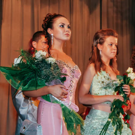 KIVERCI, UKRAINE - 27 June 2009: Unknown graduation girls posing on stageのeditorial素材