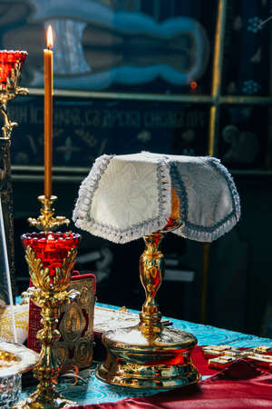 Golden cup of wine on the table in altar at orthodox church