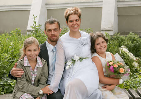 Lutsk, Volyn / Ukraine - July 26 2009: Wedding couple bride and groom with children near churchのeditorial素材
