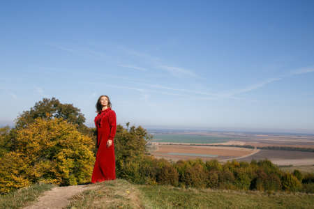 Woman in dress on the hill