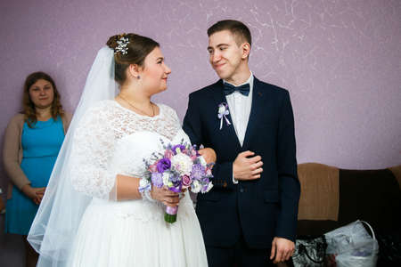 Lutsk, Volyn / Ukraine - September 16 2018: The bride and groom look at each other at homeのeditorial素材