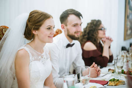 Cuman, Volyn / Ukraine - April 29 2018: Wedding couple on party at restaurant. Shallow depth of field.のeditorial素材