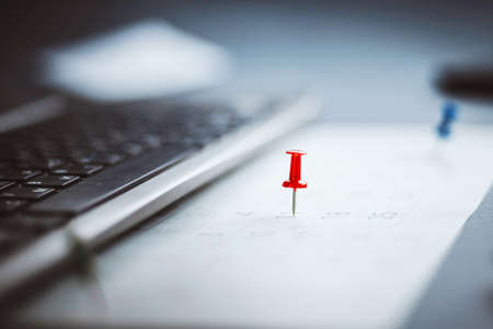 Calendar page with drawing-pins. Shallow depth of field.の写真素材
