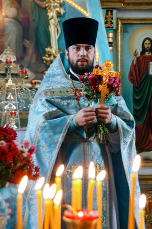 VOYUTYN, Volyn / UKRAINE - October 14 2009: Orthodox priest during holiday prayers in local church