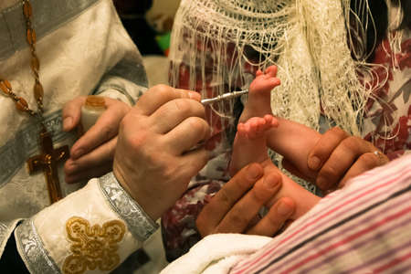 The ceremony of christening the little girl at church