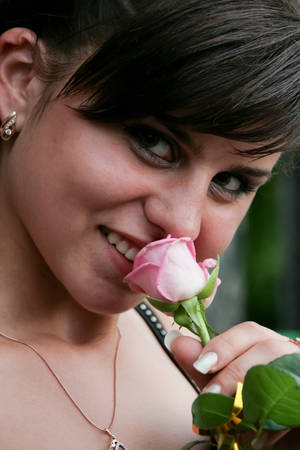 Kiverci, Volyn / Ukraine - June 27 2009: Young girl posing with rose at parkのeditorial素材