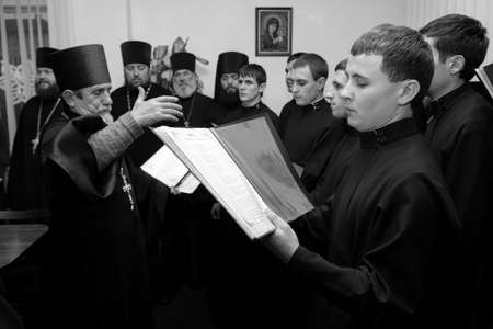 Lutsk, Volyn / Ukraine - January 10 2011: Ukrainian Orthodox religious choir singers during a celebration Christmas in office. Shallow depth of field.のeditorial素材