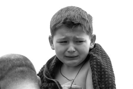 Lutsk, Volyn / Ukraine - January 19 2011: Father with child crying wrapped in towel on Orthodox Holy Epiphany Dayのeditorial素材