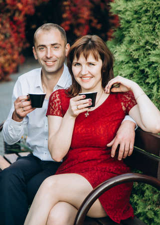 Lutsk, Volyn / Ukraine - October 24 2019: Couple posing with coffee cups at parkのeditorial素材