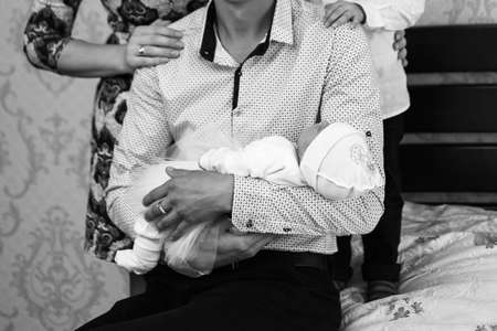 Man with child in the bed at home. Shallow depth of field.の写真素材