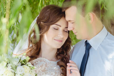 Maryanivka, Volyn / Ukraine - May 21 2017: Bride and Groom at wedding Day walking Outdoors on spring natureのeditorial素材