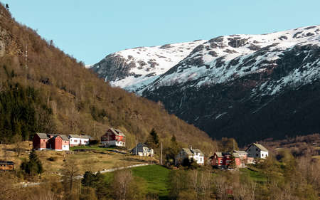 Spring rural landscape with houses in mountains, Norway