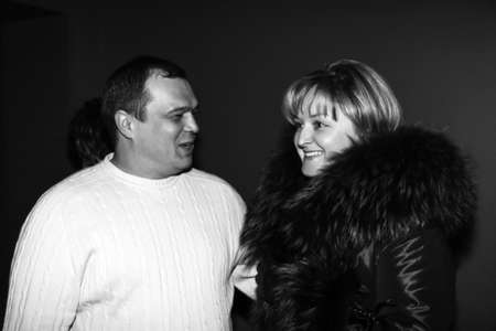 Lutsk, Volyn / Ukraine - February 06 2010: Man and woman wearing winter clothes posing together at lobbby of restaurantのeditorial素材