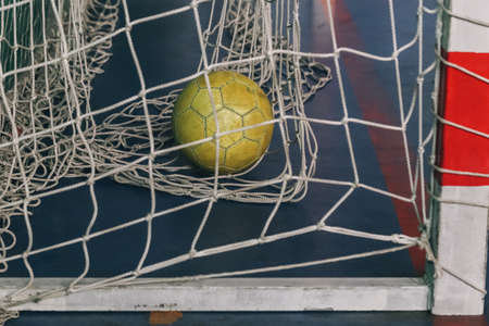 Soccer goal in the mini football hall, scoring moment minifootball