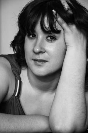 Young Woman in casual clothes is looking at camera at homeの写真素材