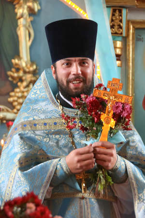 VOYUTYN, Volyn / UKRAINE - October 14 2009: Orthodox priest during holiday prayers in local church