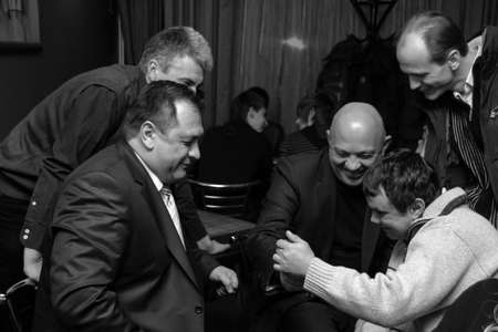 Lutsk, Volyn / Ukraine - February 06 2010: Men having meeting at restaurantのeditorial素材