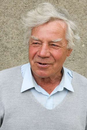 Ivanychi, Volyn - Ukraine - May 28 2010: Senior man is posing on gray backgroundのeditorial素材