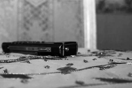 Realistic old mobile phone on the table. Shallow depth of field.の写真素材