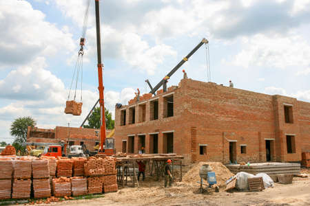 Mulchyci, Ukraine - June 22 2011: Construction of the building of brick.