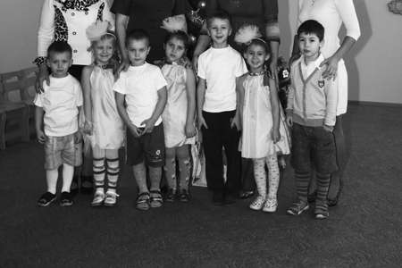 Lutsk, Ukraine - December 26 2012: Group of children posing with teachers in Kindergartenのeditorial素材