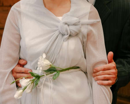 Cropped view of woman and man holding hands. Shallow depth of field.
