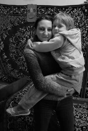 Volycia, Ukraine - March 25 2009: Mother and young daughter posing at homeのeditorial素材