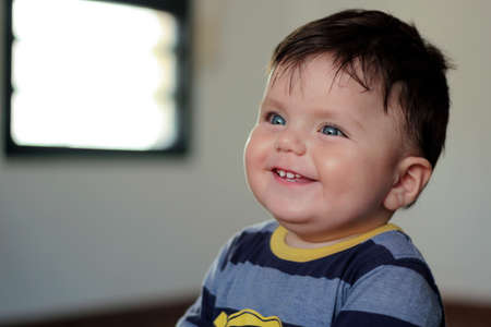 Close Up portrait of adorable child. Funny smiling toddler, healthy childhood. Shallow depth of...