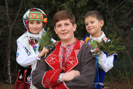 Lutsk, Ukraine - January 02 2014: Three children in traditional ukrainian clothes posing at parkのeditorial素材