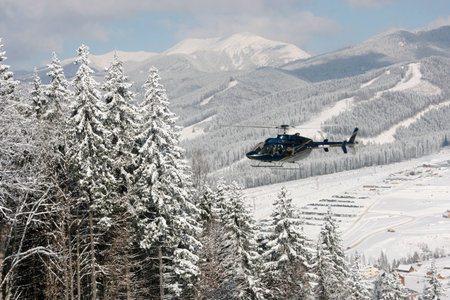 Bukovel, Ukraine - March 08 2010: Helicopter at Carpathian Mountains ski resort in winterのeditorial素材