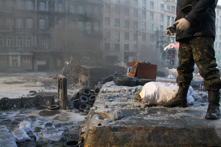 Kyiv, Ukraine - January 24 2014: Riots in the city. Citizens in conflict with the power. Protesters  harness tires and vehicles. Police disperse demonstrators. People fighting for their rights.のeditorial素材