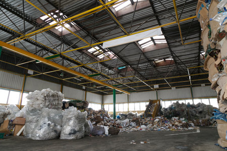 Plastic pressed bales and paper at the storage of recycling center. Separate garbage collection.の写真素材