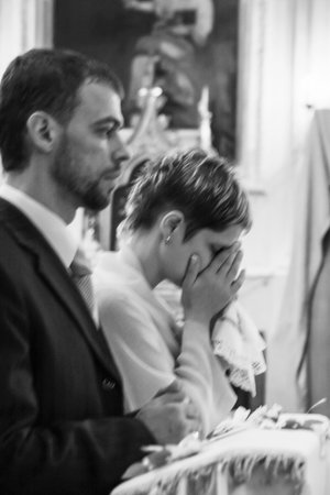 Wedding couple in christianity church. Shallow depth of field.の写真素材