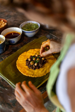 Close up of hands preparing hallaca or tamale. Traditional food conceptの写真素材