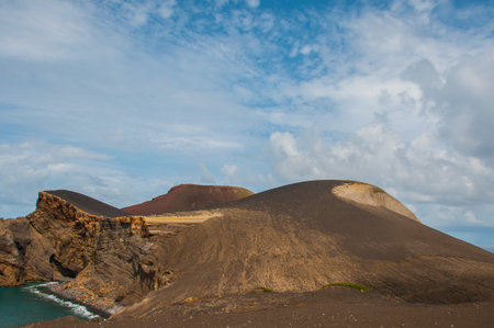 The Capelinhos volcano was born at sea, in the parish of Capelinhos, in Faial Island, Azores and its activity extended from September 1957 to October 1958の写真素材