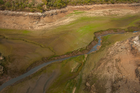 The Ponsul River is a affluent of the Tejo River, in Portugal, and is a very large river. At this time it is completely dry, without water and with its bed cracked.の写真素材